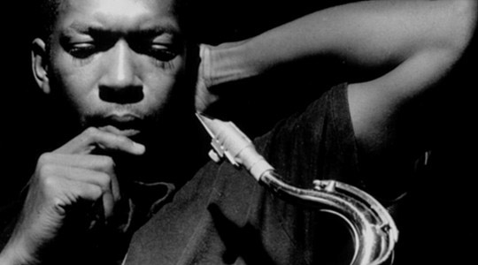 John Coltrane with Tenor wetting a reed
