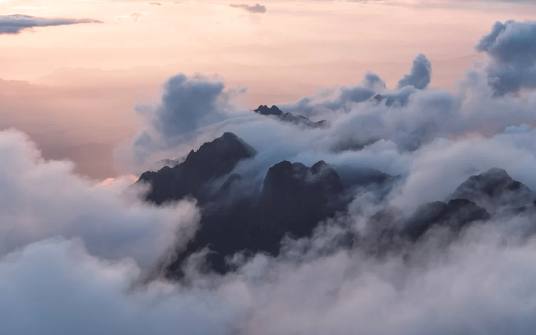 andreas-kind-above the clouds image unsplash