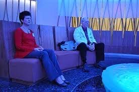 Tracy Berger, left, a Duke marriage and family therapist, meditates with Jon Seskevich, right, a Duke Hospital nurse clinician, during a meditation session in the Duke Cancer Center's Quiet Room. Photo by April Dudash