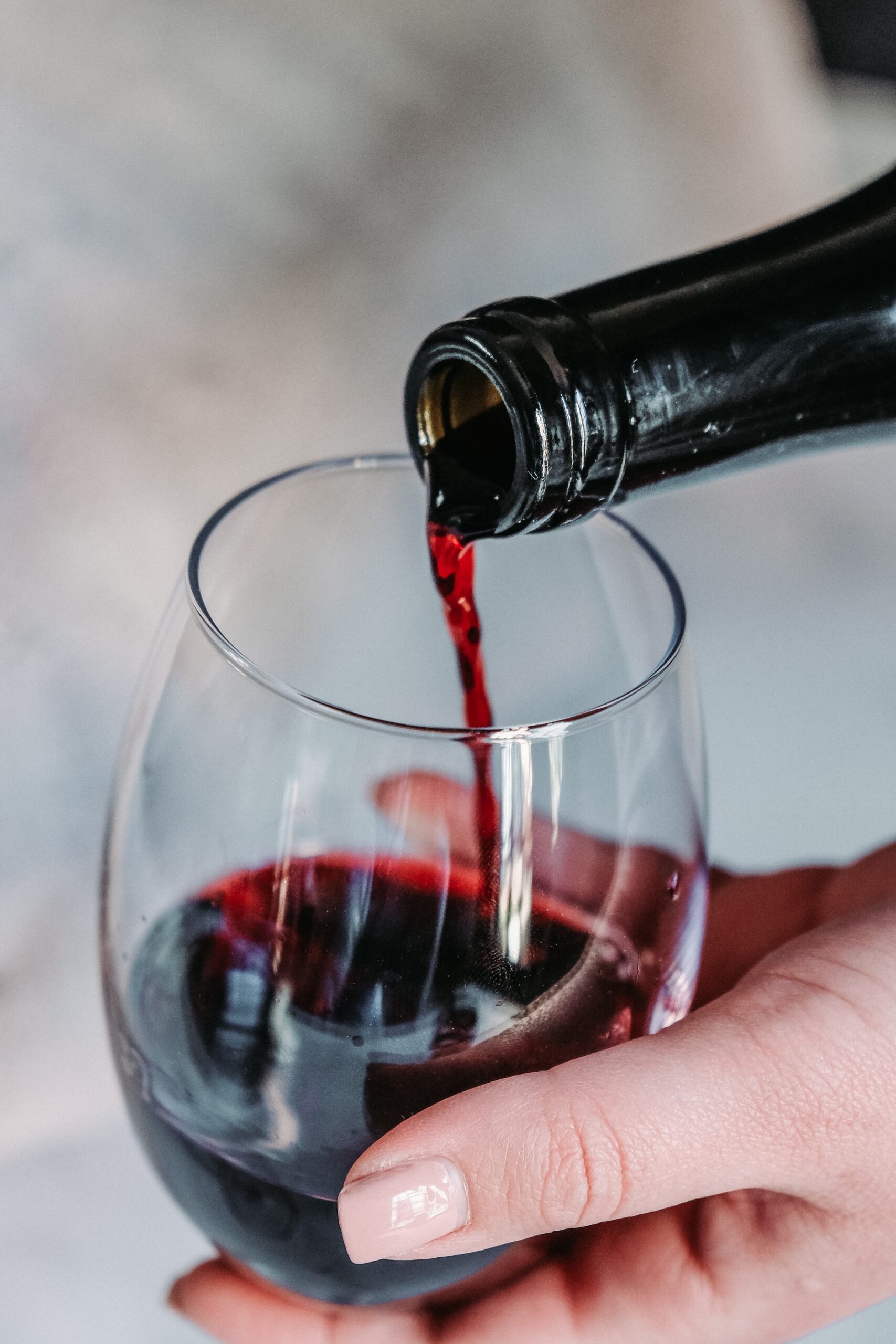 jeff-siepman-red wine pour in wine glass up close-unsplash