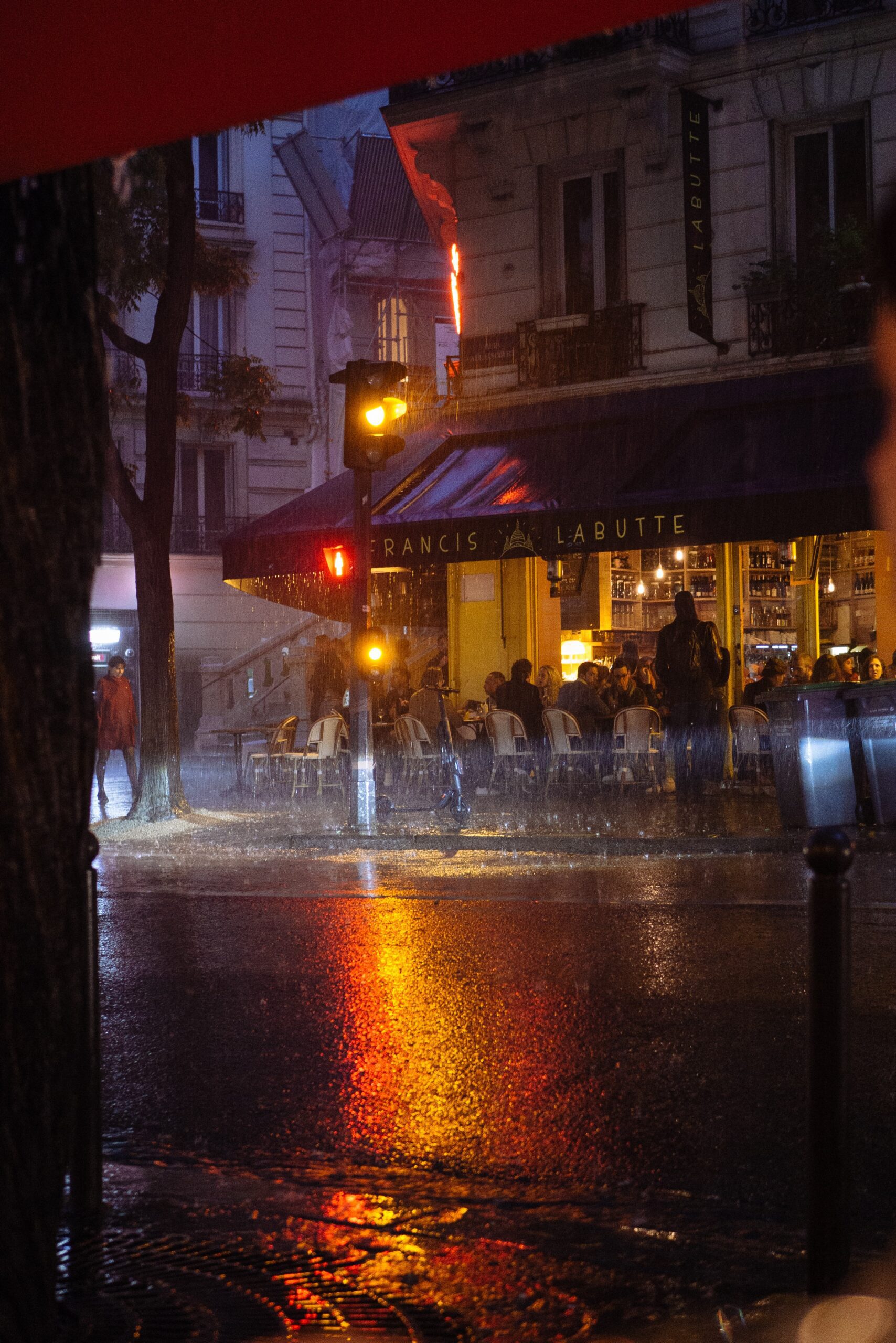 matthee-A rainy night in Paris, while sitting dry under a heater. Beautiful reflections on a soaked street gave a very special vibe while eating dinner.-unsplash. Montmartre, Paris, France Published on June 3, 2019