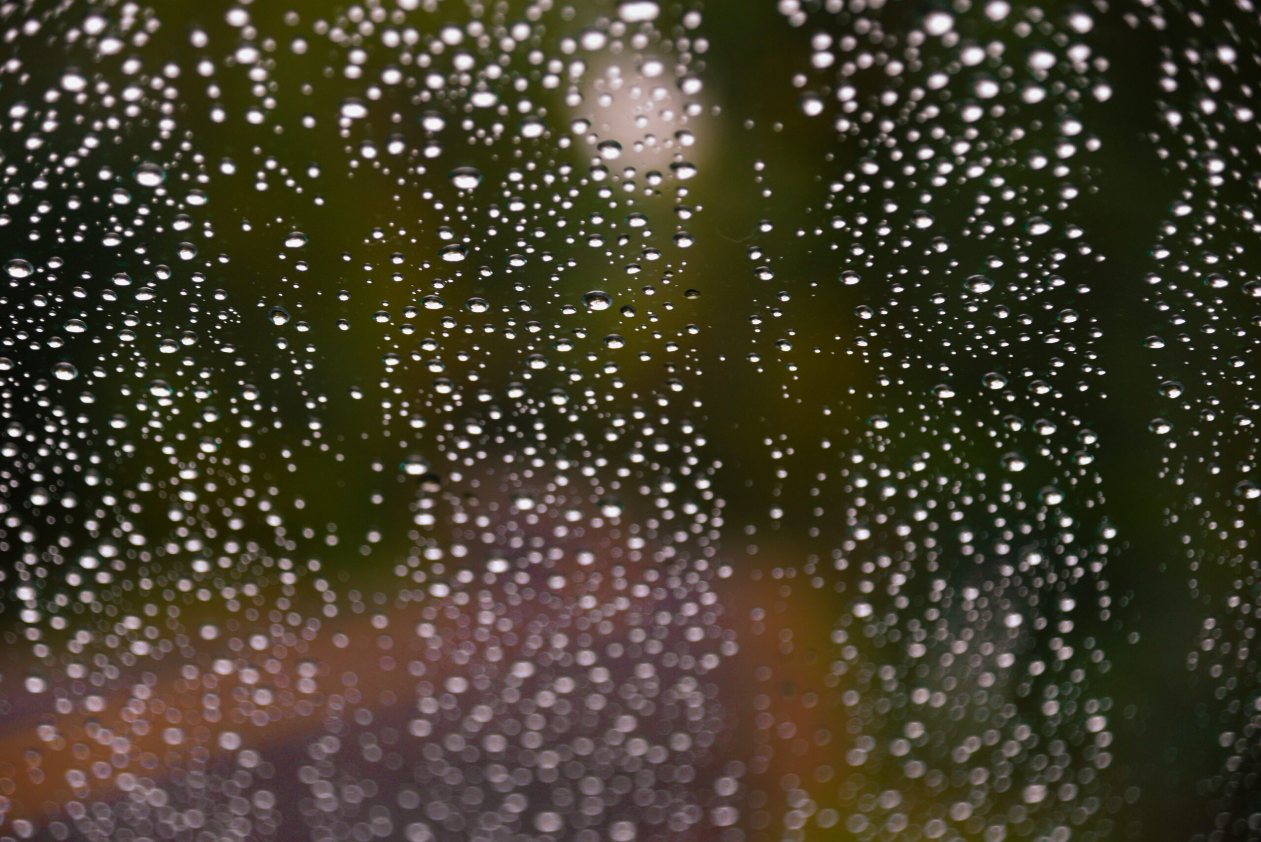 Rain drops beading on window by Franklin Crawford 2021