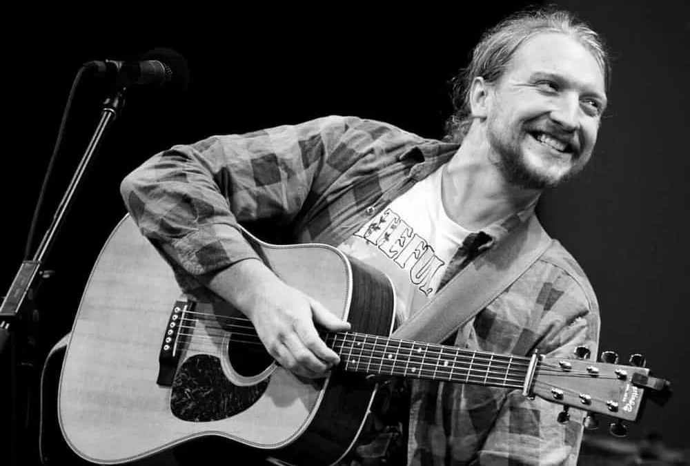 Tyler Childers with guitar header image for Durham Cool