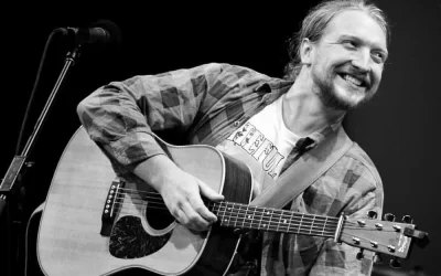 Tyler Childers with guitar header image for Durham Cool