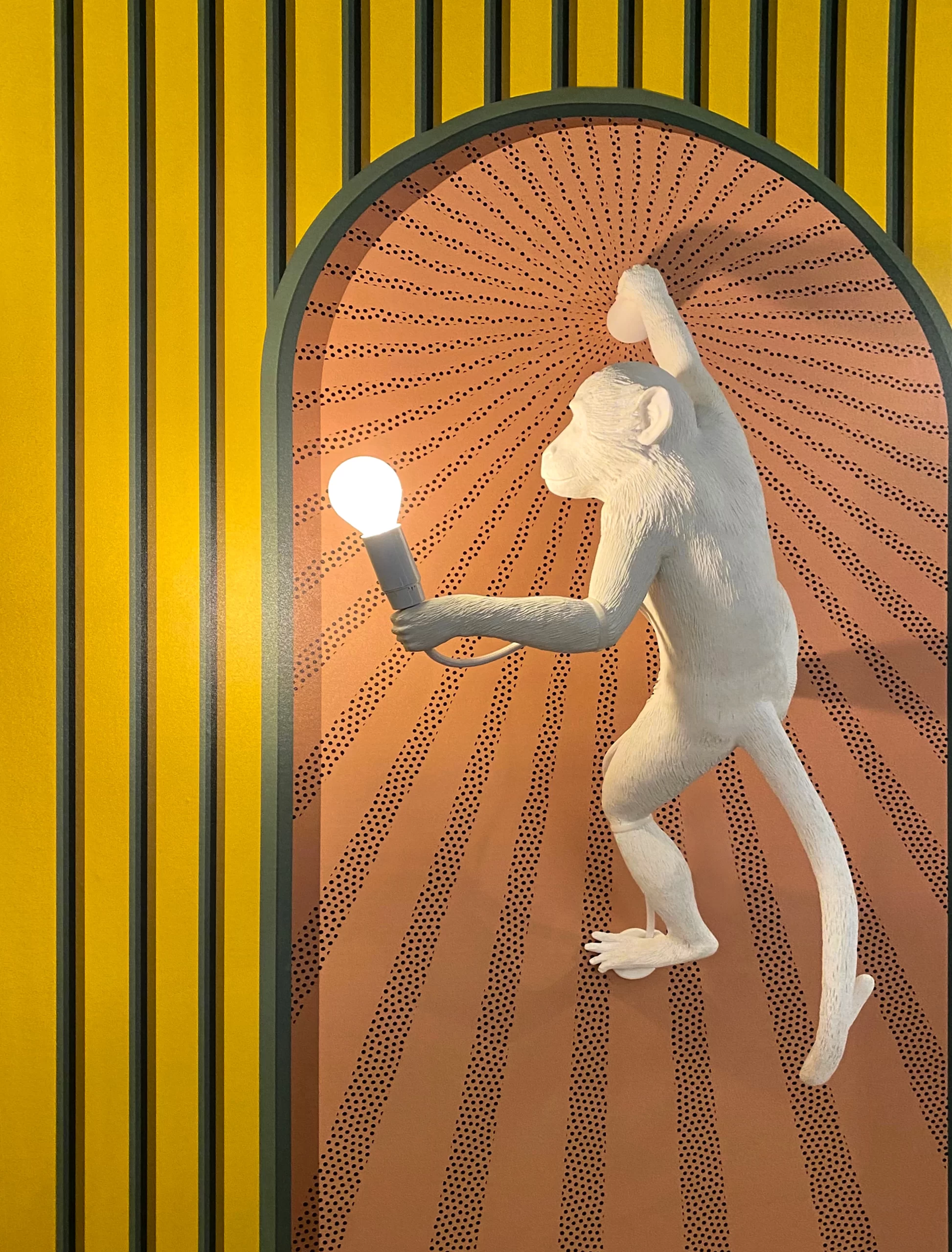 jennifer-griffin-Funky Monkey lamp on pattern wall interior design-unsplash