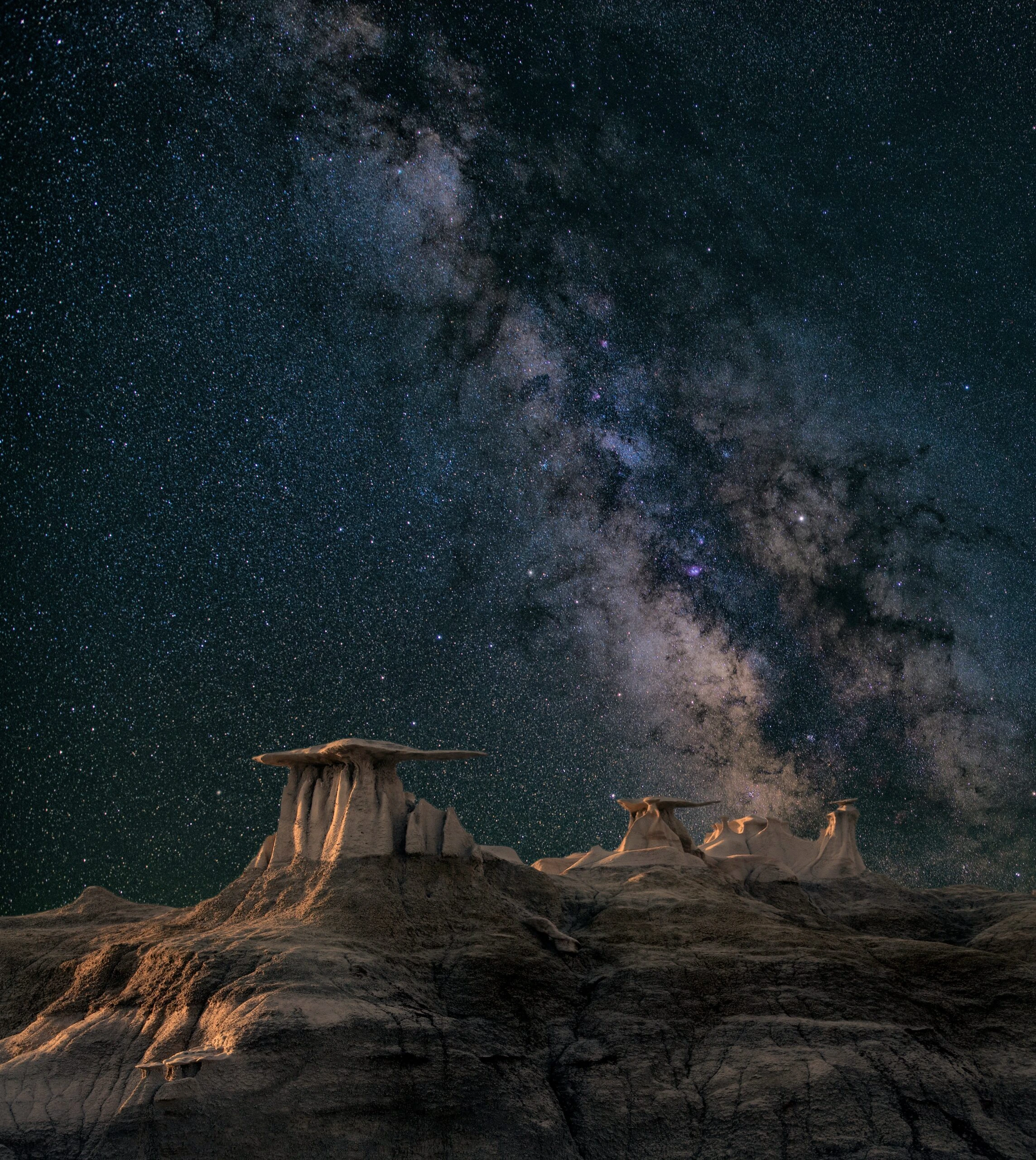 john-fowler-Aurora australis' starry sky over desert landscape-unsplash
