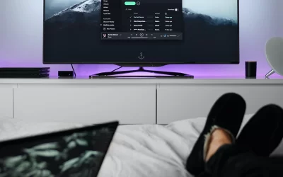 julian-o-hayon-Apple TV display with person on bed watching-unsplash-scaled