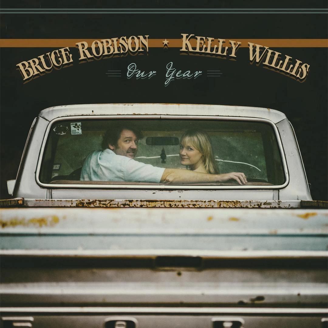 Kelly Willis and Bruce Robison looking out the rear window of flat bead truck
