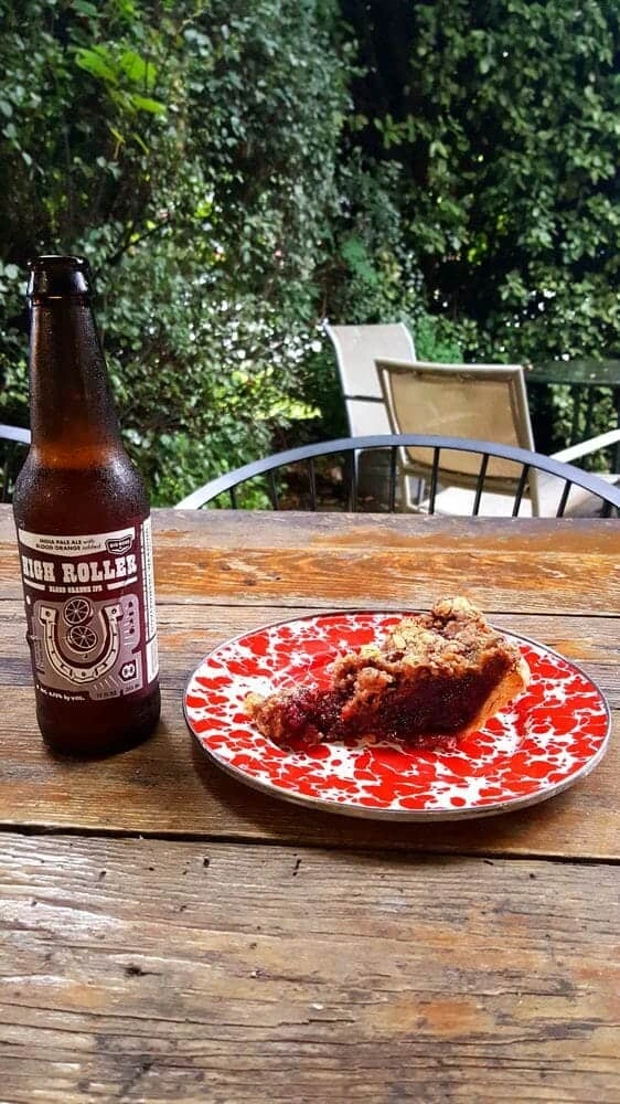 Pie on plate with beer next