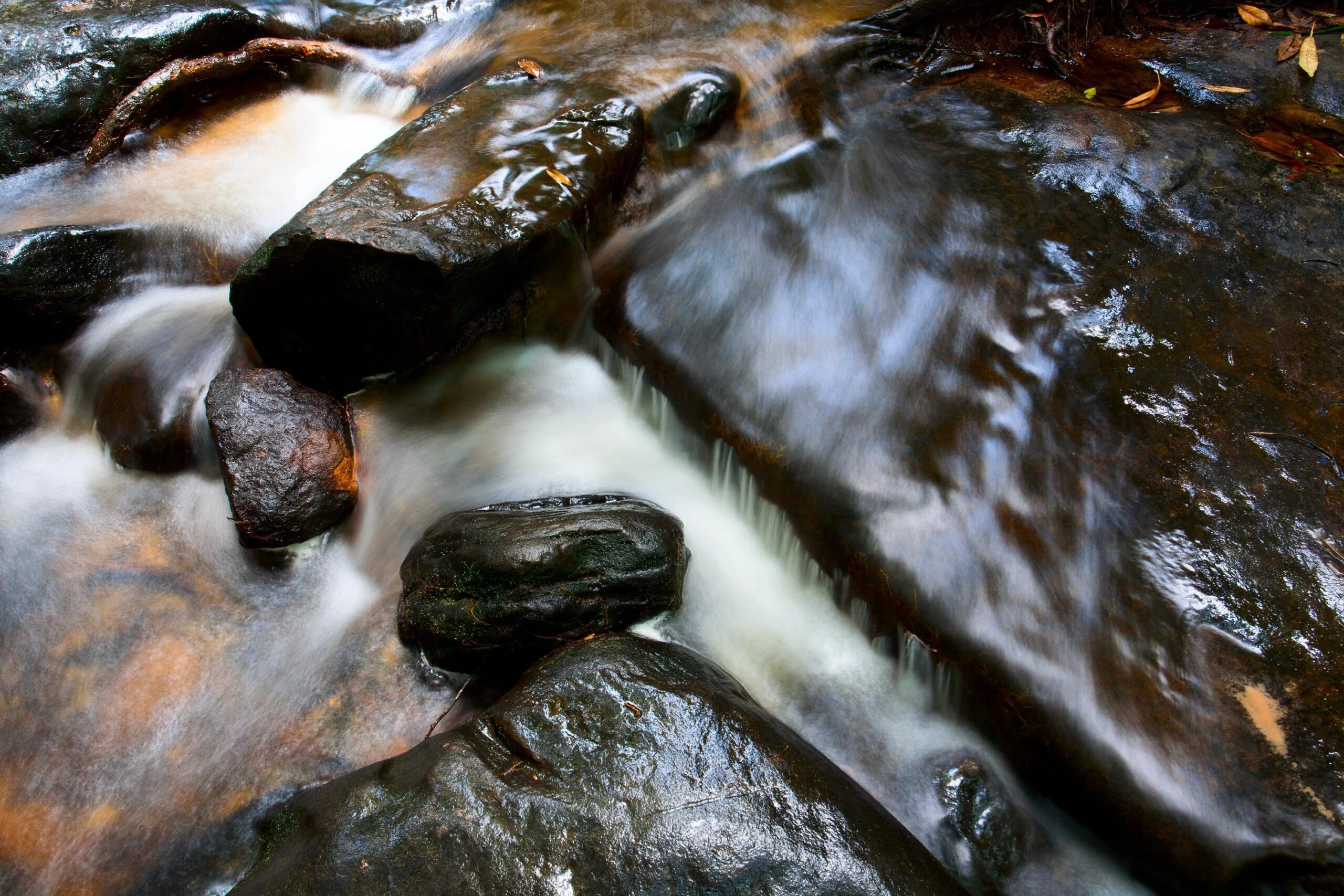 atik-sulianami-River water flowing over rocks-unsplash