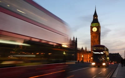 david-dibert-Double decker bus whizzing by with Big Ben in background London UK-unsplash-scaled