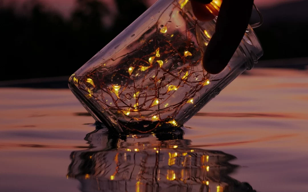 luigi-colonna-string of lights in a jar at evening dipping in wade pool-unsplash-scaled