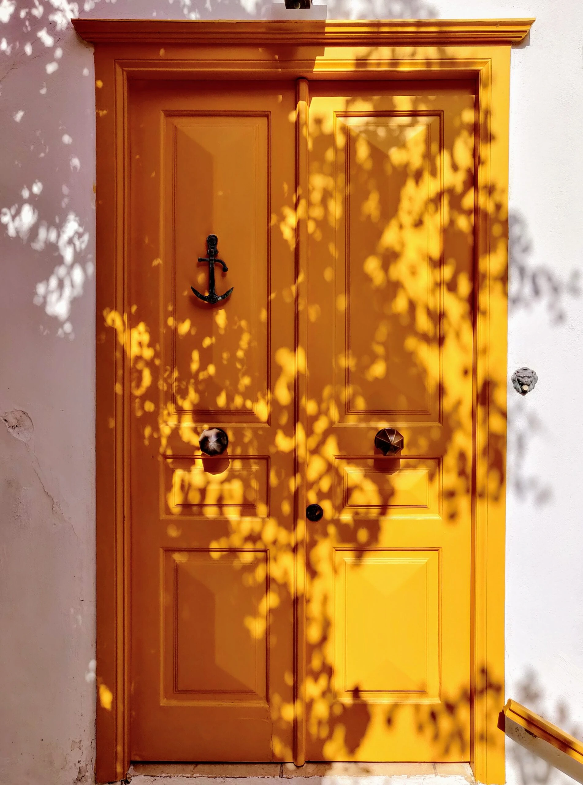 mauricio-munoz-Hydra, Greece Front door golden yellow with white stucco exterior homePublished on April 27, 2021 OnePlus, ONEPLUS A6003