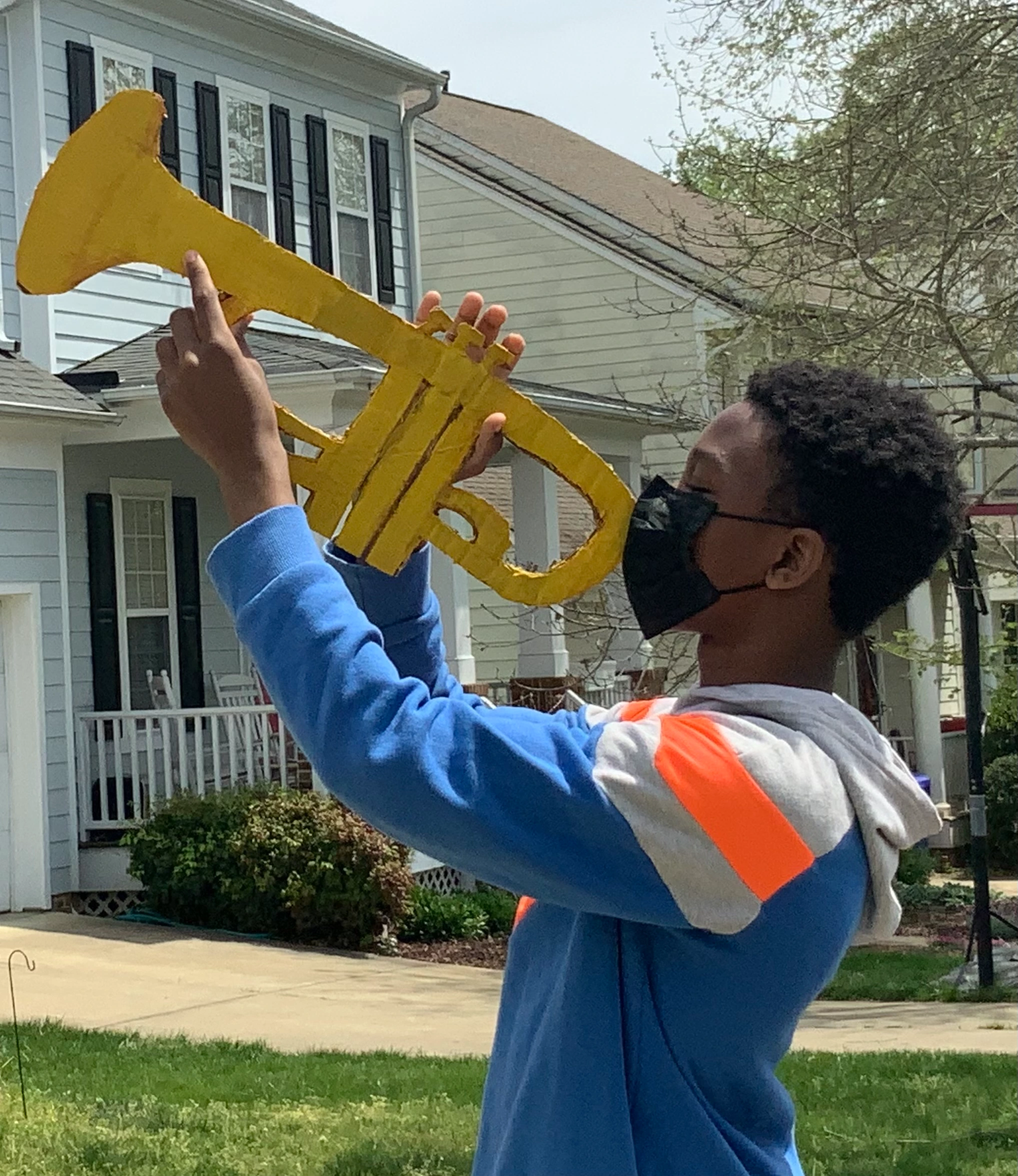 Tarin of 1,2,3 Puppetry playing trumpet for The Time We Have staging and rehearsal April 16, 2022 Ramirez home