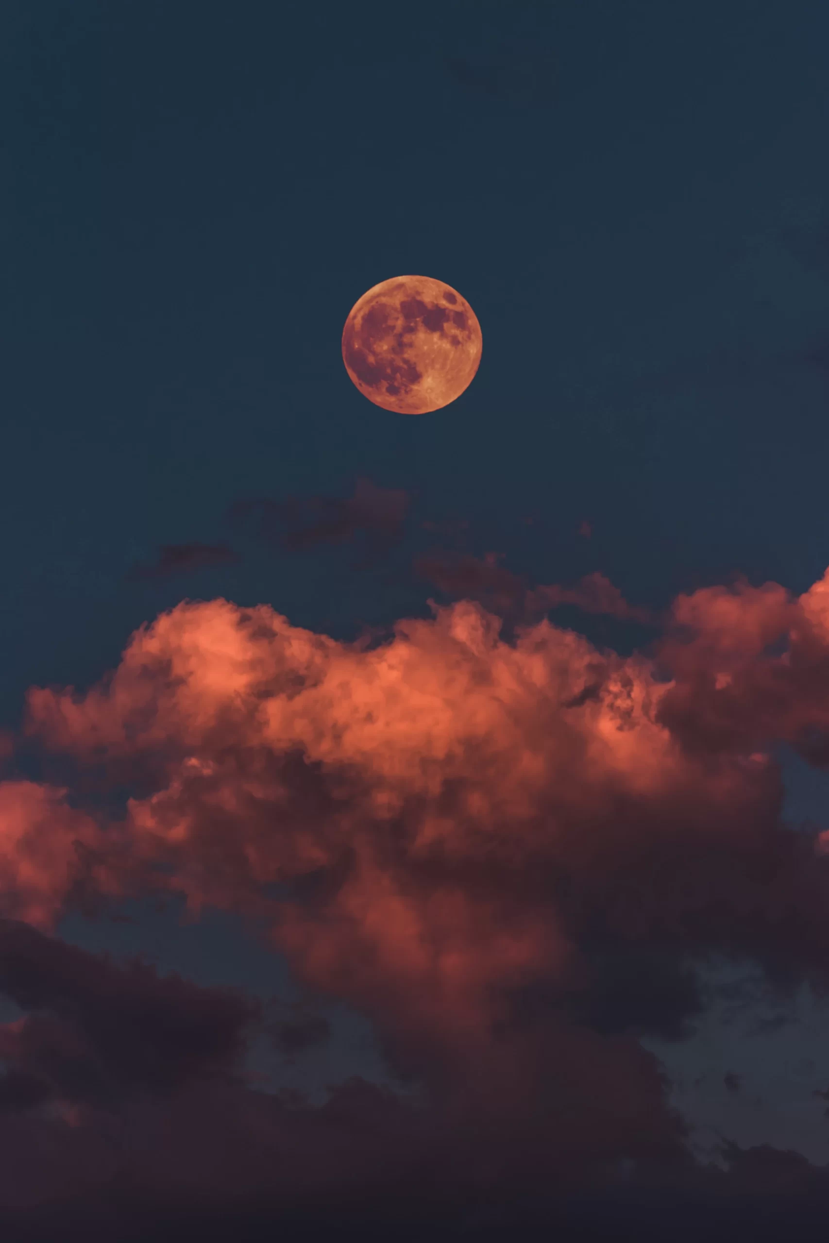 altinay-dinc-Red sunset rising moon above clouds in early eve-unsplash 