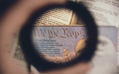 anthony-garand-We the People magnified lens held over US constitution -unsplash