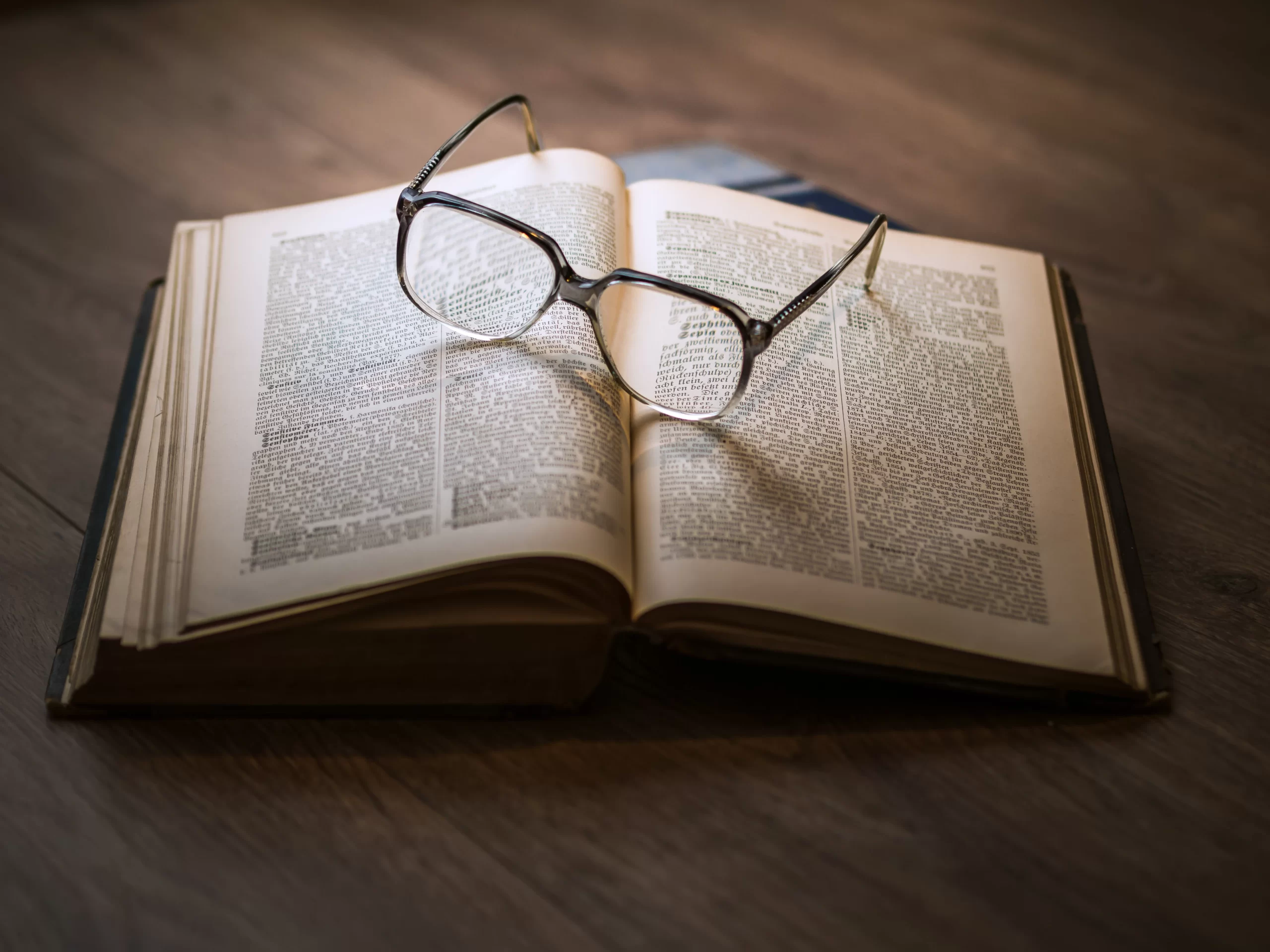 dariusz-sankowski-Law book open with glasses rested upon -unsplash