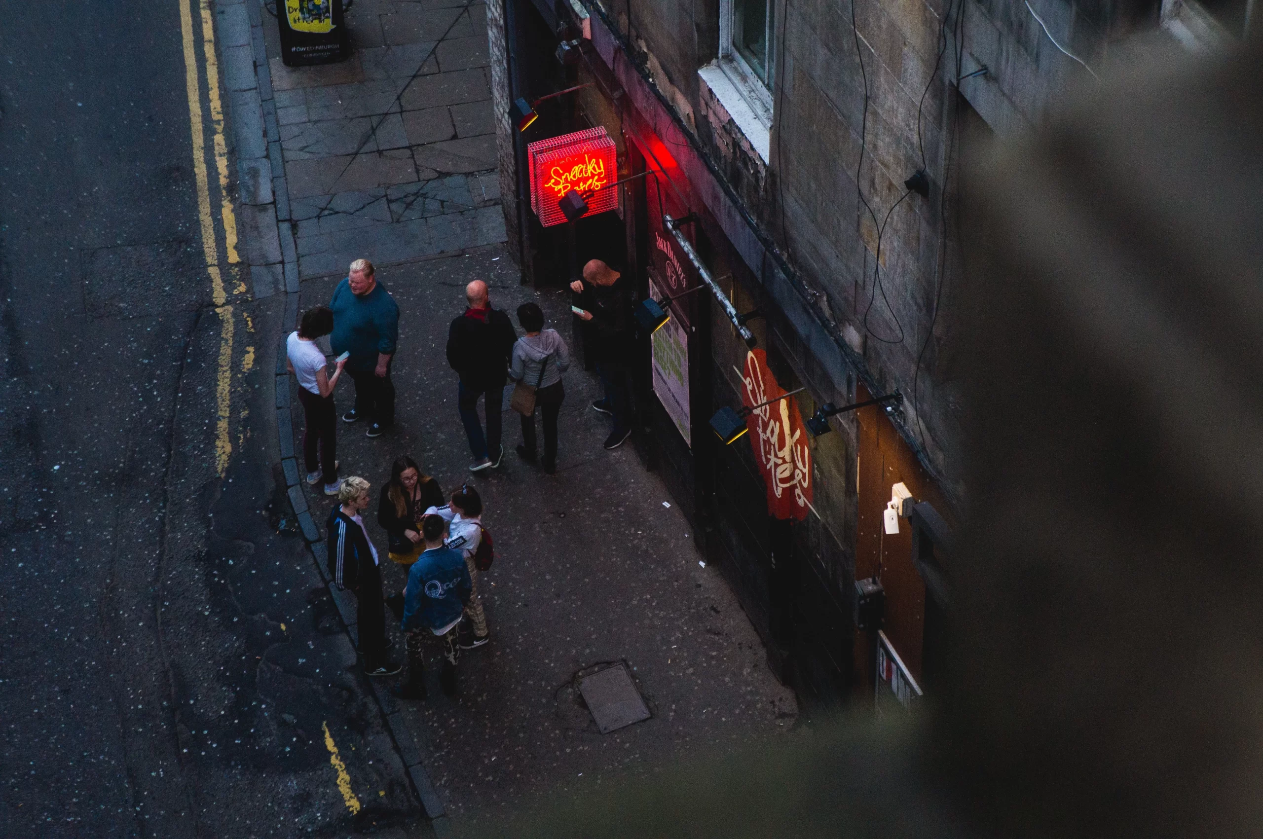People congressing outside bar eilis-garvey-JCowgate, Edinburgh, Scotland Published on July 10, 2019 SONY, NEX-3N-unsplash