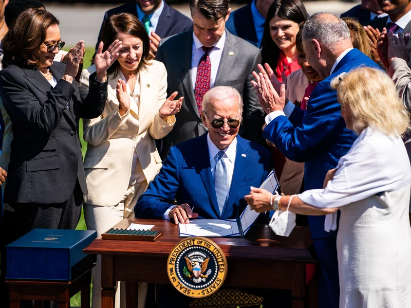 President Joe Biden signs into law the CHIPS and Science Act of 2022 on the South Lawn of the White House on Aug. 9, 2022.