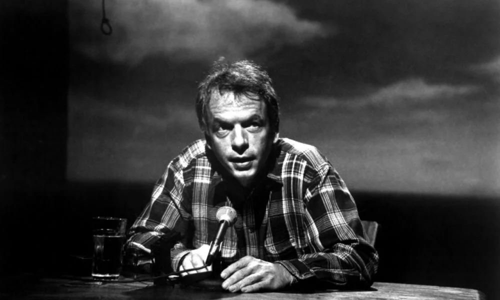 Spalding Gray at Monologue desk for and everything is goingfine.webp