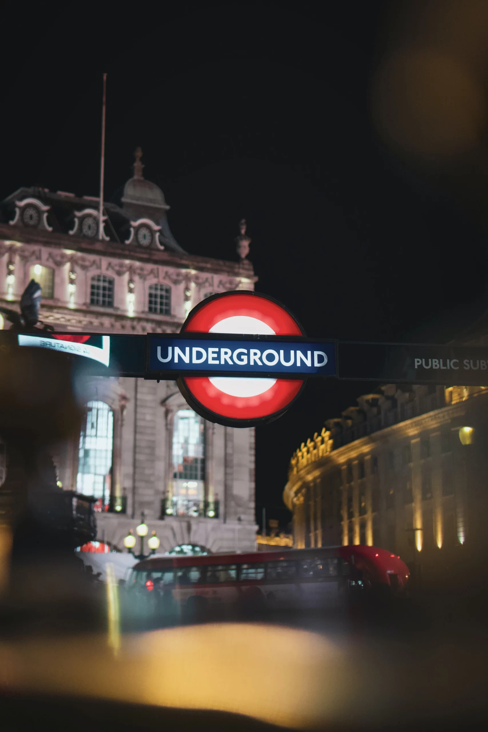 Piccadilly Circus, London, UK<br />
Published on March 4, 2020<br />
Sony, a6000<br />
Free to use under the Unsplash License<br />
Underground sign to metro subway at night in London